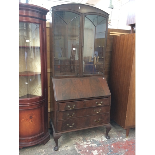 708 - A GOOD QUALITY EARLY 20TH CENTURY FLAME MAHOGANY BUREAU BOOKCASE WITH THREE DRAWERS, FALL FRONT AND ... 