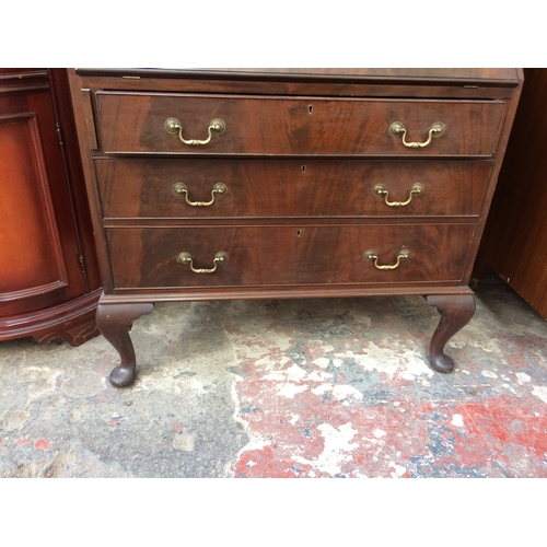 708 - A GOOD QUALITY EARLY 20TH CENTURY FLAME MAHOGANY BUREAU BOOKCASE WITH THREE DRAWERS, FALL FRONT AND ... 