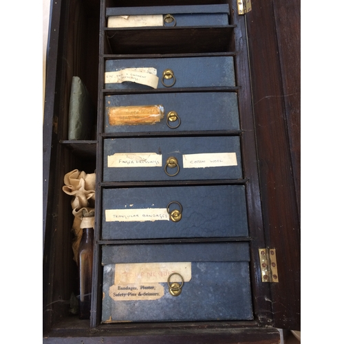 462 - A VINTAGE FIRST AID CABINET WITH INNER DRAWERS AND CONTENTS