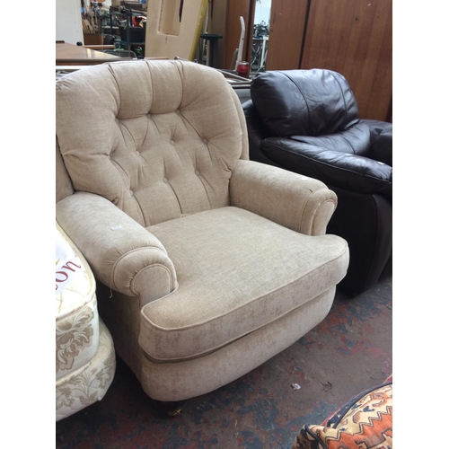 755 - A BEIGE UPHOLSTERED ARMCHAIR