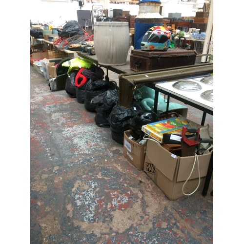 119 - A LARGE MIXED LOT TO INCLUDE BAGS AND BOXES CONTAINING CLOTHING, FOOTWEAR, GAMES, ORDNANCE SURVEY MA... 