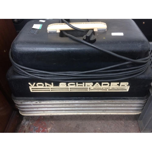 213 - A BLACK VON SCHRADER UPHOLSTERY CLEANER WITH HOSES AND ATTACHMENTS