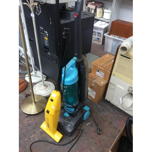 219 - TWO ITEMS TO INCLUDE A BLUE AND GREY HOOVER HURRICANE UPRIGHT BAGLESS VACUUM CLEANER AND A YELLOW EL... 