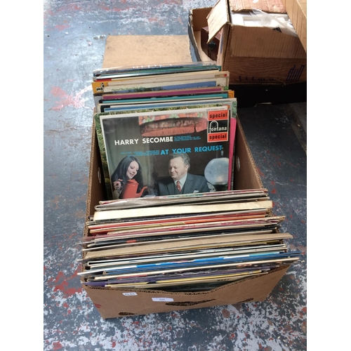 253 - A BOX CONTAINING MIXED 45 AND LP RECORDS TO INCLUDE JUDY GARLAND, THE BEATLES ETC