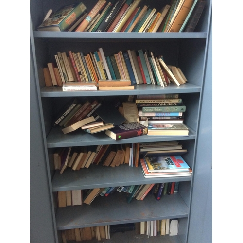 26 - A GREY METAL TWO DOOR OFFICE STORAGE CABINET CONTAINING A LARGE QUANTITY OF BOOKS