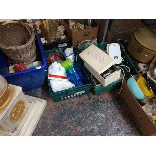 260 - EIGHT BOXES CONTAINING MIXED ITEMS TO INCLUDE BOOKS, WICKER BASKETS, ELECTRIC FANS, KITCHENWARE, GLA... 