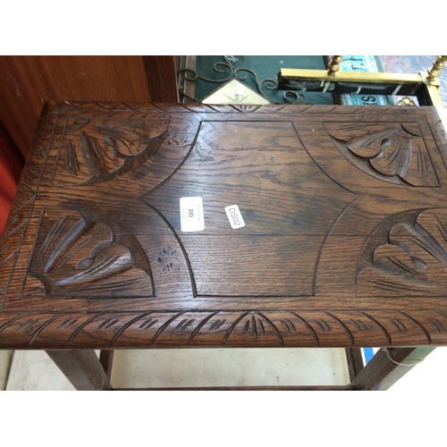 285 - A GOOD QUALITY CARVED OAK STOOL