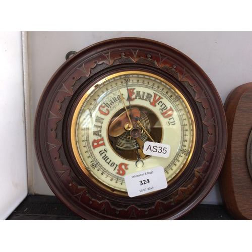 324 - AN ANTIQUE MAHOGANY BAROMETER AND A TAYLOR MAHOGANY BAROMETER