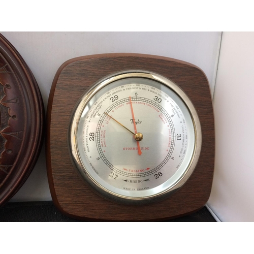 324 - AN ANTIQUE MAHOGANY BAROMETER AND A TAYLOR MAHOGANY BAROMETER