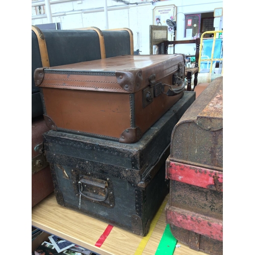 347 - TWO VINTAGE LEATHER SUITCASES AND A METAL BOUND TRAVELLING TRUNK