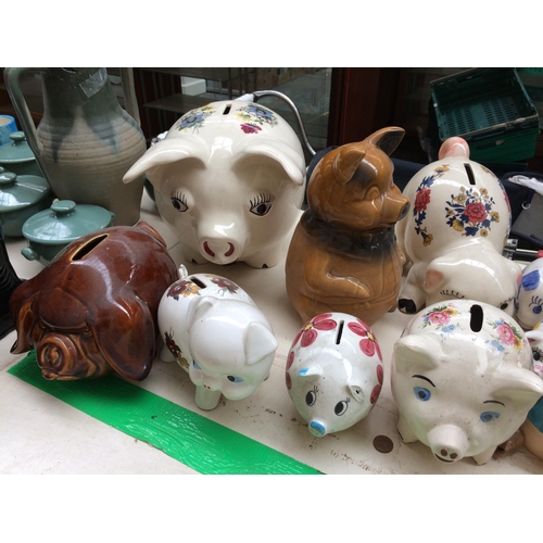 389 - A COLLECTION OF CERAMIC PIGGY BANKS