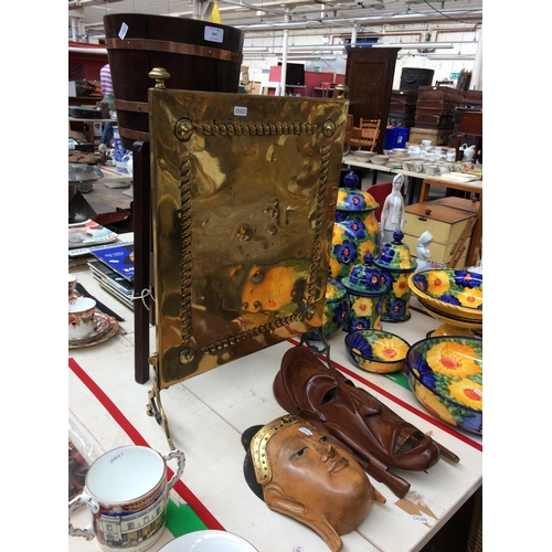 397 - FOUR ITEMS TO INCLUDE A BRASS FIRE SCREEN, TWO WOODEN MASKS AND AN OAK COPPER BOUND WINE BUCKET ON S... 