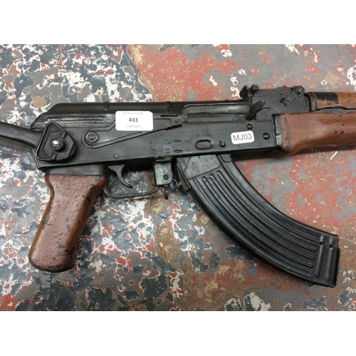 431 - AN AK-47 FILM PROP RIFLE WITH FOLDING STOCK, USED IN LORD OF WAR FILM