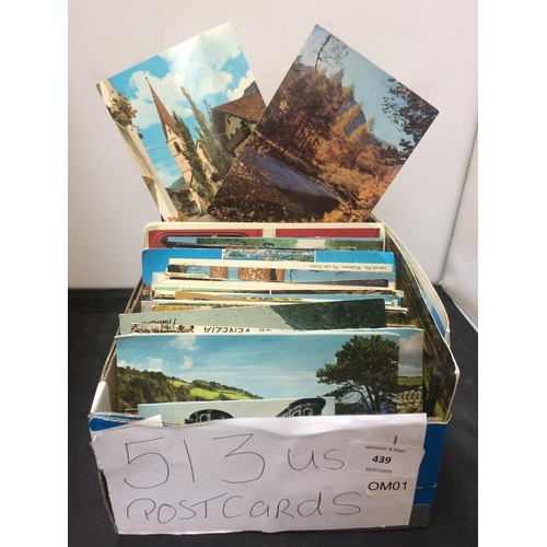 439 - A BOX CONTAINING 513 POSTCARDS