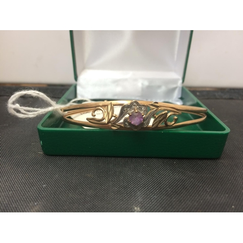 462 - A 9CT GOLD DIAMOND AND AMETHYST BANGLE (WEIGHT 6.5 GRAMS)