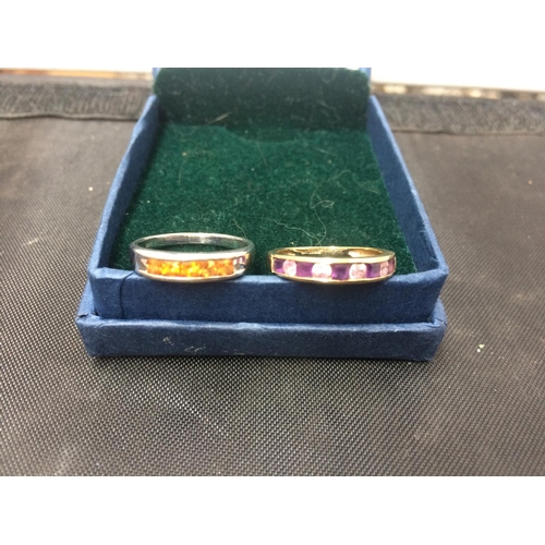 470 - TWO RINGS TO INCLUDE AN ORANGE STONE SIZE N1/2 RING AND A PURPLE STONE SIZE N RING