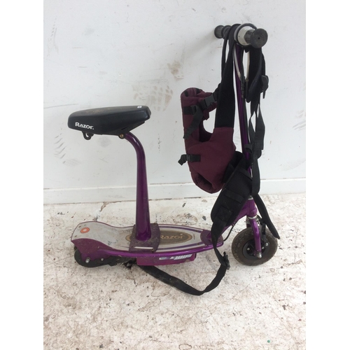 5 - A PURPLE RAZOR TWO WHEELED ELECTRIC SCOOTER AND A BABY HARNESS