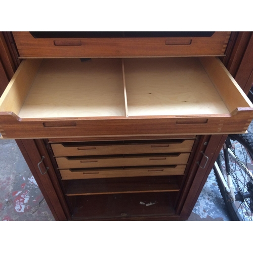 507 - A VINTAGE TEAK OFFICE FILING CABINET WITH TWO TAMBOUR DOORS AND EIGHT DRAWERS