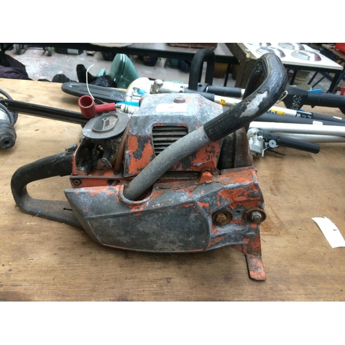 97 - AN ORANGE PETROL CHAINSAW WITH NO BAR (FOR SPARES OR REPAIRS)