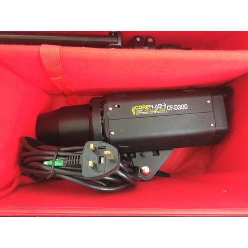 208 - A CASED COREFLASH CFD300 PROFESSIONAL PHOTOGRAPHERS LIGHTING KIT (W/O)