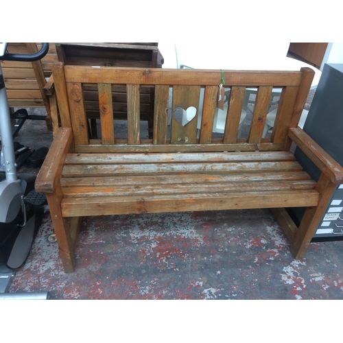 16 - A GOOD QUALITY WOODEN TWO SEAT GARDEN BENCH