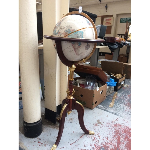 Sold at Auction: Royal geographical Society world globe on wooden