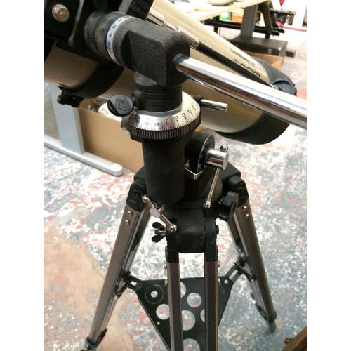 309 - A TASCO LUMINOVA TELESCOPE ON TRIPOD STAND