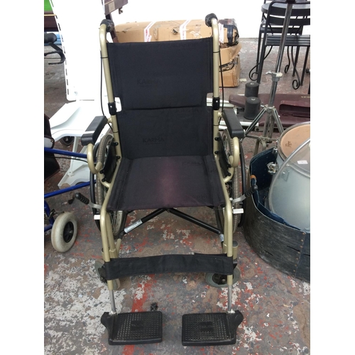 32 - A GREEN AND BLACK KARMA WHEELCHAIR