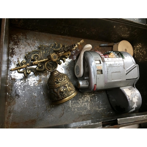 351 - A SMALL TIN BOX CONTAINING A VINTAGE ALMEX BUS TICKET DISPENSER AND A BRASS BELL