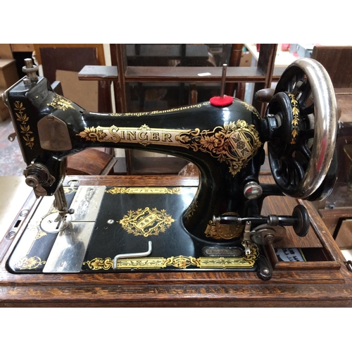 356 - A CASED VINTAGE SINGER SEWING MACHINE