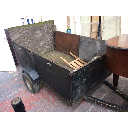 43 - A WOOD AND METAL TWO WHEELED CAR TRAILER WITH REAR TAILBOARD, 10