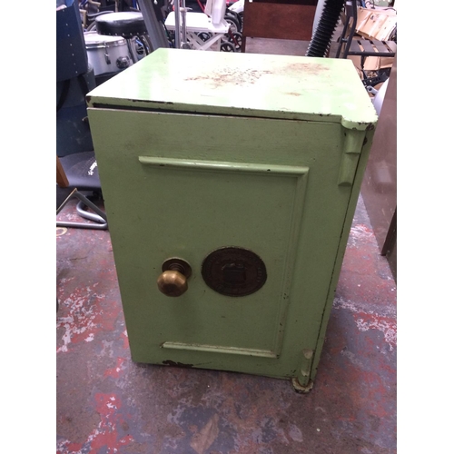 45 - A GOOD QUALITY VICTORIAN WHITFIELD OF BIRMINGHAM GREEN PAINTED IMPREGNABLE FIREPROOF SAFE WITH TWO I... 