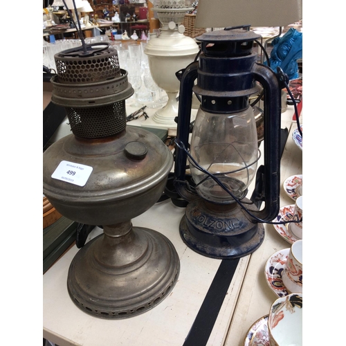 499 - A COLLECTION OF MIXED ITEMS TO INCLUDE FIVE VINTAGE OIL LAMPS, OAK BAROMETER AND TWO PIG PICTURES