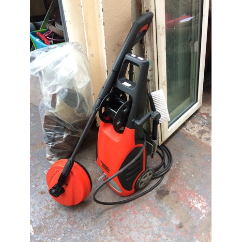 61 - A BLACK AND ORANGE BLACK & DECKER PW1700SPN ELECTRIC PRESSURE WASHER WITH HOSE, LANCE AND BRUSH ATTA... 