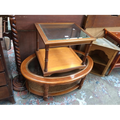 720 - A MAHOGANY GLASS TOP OVAL COFFEE TABLE AND A MAHOGANY GLASS TOP SQUARE COFFEE TABLE