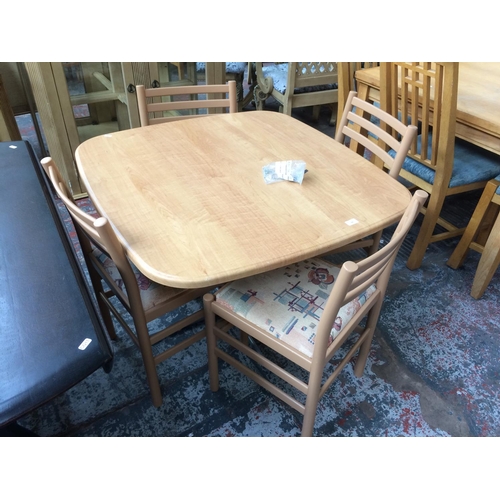 745 - A MODERN BEECH EFFECT KITCHEN TABLE AND FOUR MATCHING LADDER BACK CHAIRS