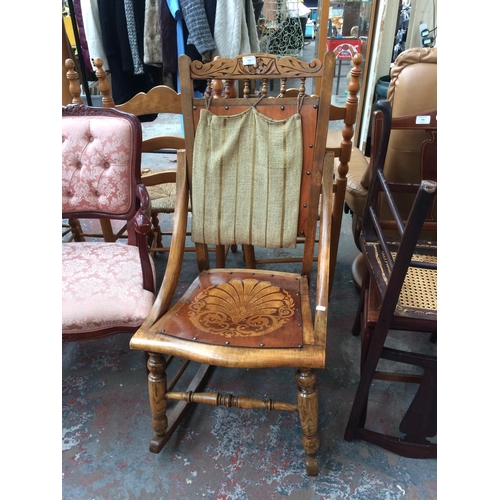 767 - A VINTAGE MAHOGANY FRAMED ROCKING CHAIR WITH PRINCE OF WALES FEATHERS INLAY