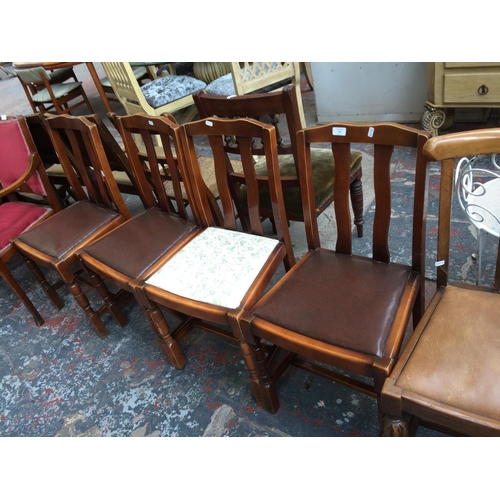 784 - FOUR VINTAGE DARK OAK FRAMED DINING CHAIRS TO INCLUDE THREE WITH BROWN LEATHERETTE SEATS AND ONE FLO... 