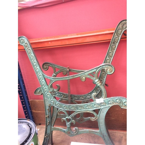 80 - A PAIR OF GREEN PAINTED CAST IRON ORNATE GARDEN BENCH ENDS