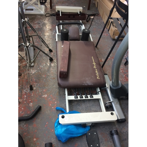 34 - A WHITE PILATES PERFORMER EXERCISE MACHINE