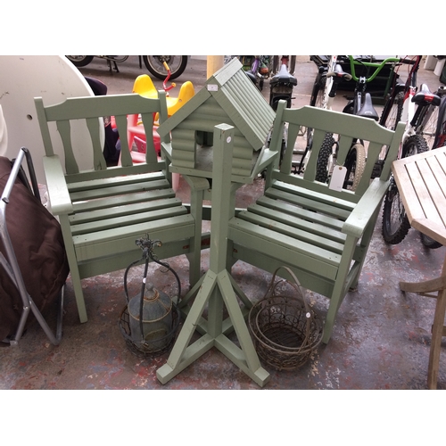 57 - SIX ITEMS TO INCLUDE A TWO SEAT GARDEN BENCH SET WITH CENTRAL TABLE, MATCHING BIRD TABLE, THREE HANG... 