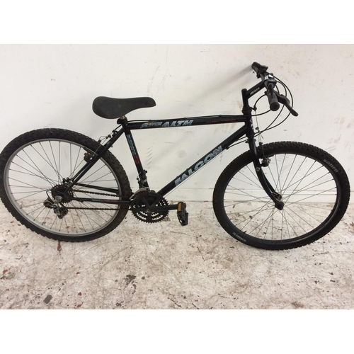 11 - HIS AND HERS BLACK FALCON STEALTH MOUNTAIN BIKES BOTH WITH 15 SPEED SHIMANO GEAR SYSTEM