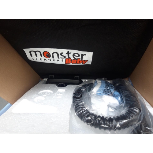 219 - A BOXED MONSTER BABY HANDHELD STEAM CLEANER