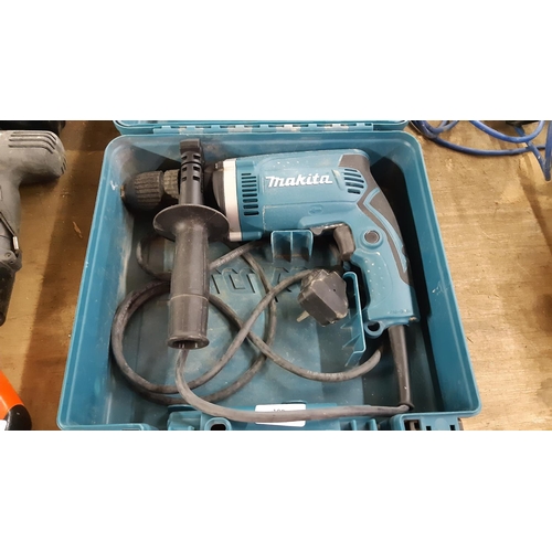 109 - A CASED GREEN MAKITA HP1631 ELECTRIC DRILL