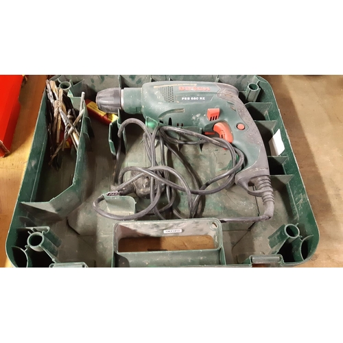 113 - A CASED GREEN BOSCH PSB680RE ELECTRIC DRILL