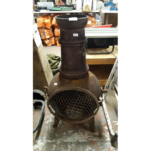 129 - A CAST IRON ORNATE GARDEN CHIMINEA