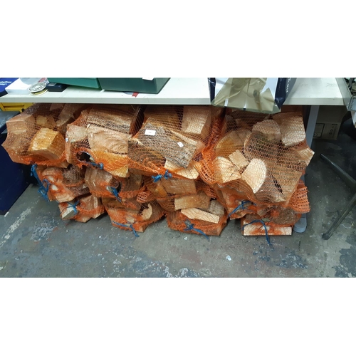 150 - TWELVE BAGS OF FIRE LOGS