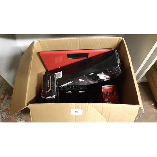 230 - A BOX CONTAINING BABYLISS PRO CURL HAIR CURLERS, REMINGTON HAIR STRAIGHTENERS, RED BATHROOM SCALES, ... 