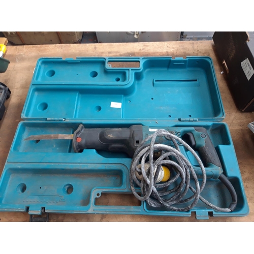 126 - A CASED MAKITA 110V HANDHELD SAW