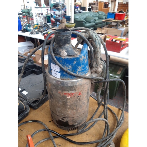 131 - A BLUE AXMINSTER SUBMERSIBLE WATER PUMP